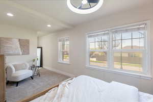 Carpeted bedroom featuring recessed lighting, beam ceiling, and baseboards