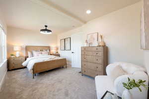 Carpeted bedroom with baseboards and recessed lighting