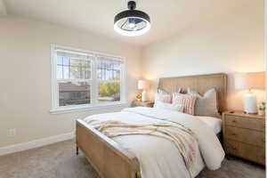 Carpeted bedroom with baseboards