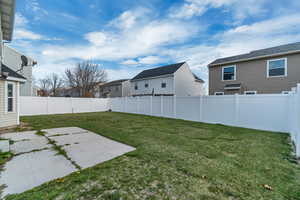 View of yard with a patio, a residential view, and a fenced backyard