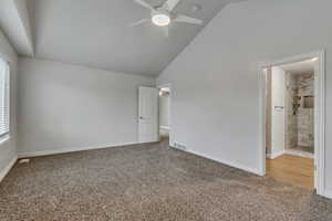 Unfurnished bedroom featuring ensuite bath, a ceiling fan, visible vents, carpet floors, and baseboards