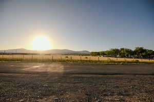 View of yard with a mountain view and a view of rural / pastoral area