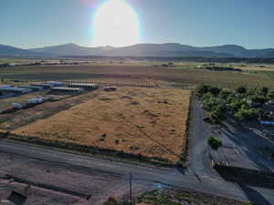 Overview of rural landscape featuring a mountainous background