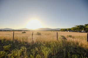 View of yard with a mountain view and a view of rural / pastoral area