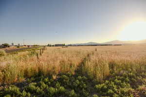 View of undeveloped land with rural landscape and mountains