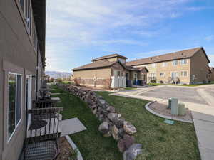 View of yard featuring mail area and a residential view