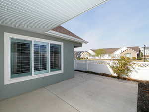 View of patio / terrace with a residential view and fence