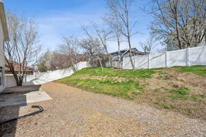 View of yard with a patio and a fenced backyard