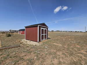View of shed featuring a rural view