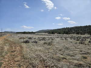 Property view of mountains featuring a rural view