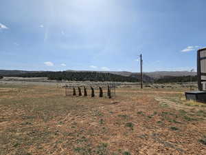 View of yard with a rural view