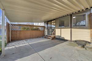 View of patio / terrace featuring entry steps and fence