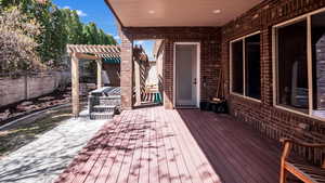 Deck with a pergola and fence