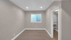 Unfurnished bedroom featuring baseboards, recessed lighting, and light colored carpet