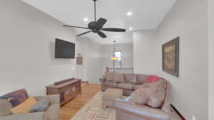 Living area with recessed lighting, light wood-type flooring, and ceiling fan