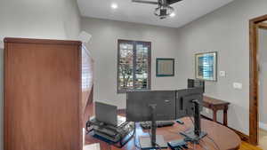 Home office with recessed lighting, baseboards, a ceiling fan, and wood finished floors