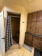 Bathroom with a shower stall and vanity