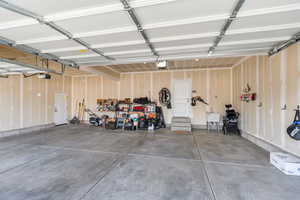 Garage featuring a garage door opener