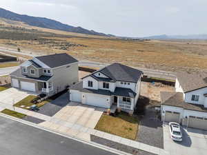 Birds eye view of property with a rural view and a mountain view