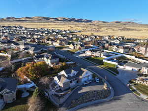 Birds eye view of property with a mountain view and a residential view