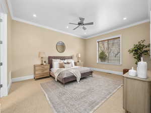 Bedroom with recessed lighting, baseboards, light colored carpet, and crown molding