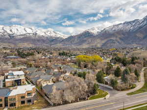 Property view of mountains with a residential view