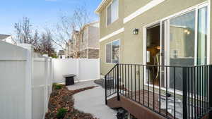 View of patio with a fenced backyard