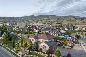Aerial perspective of suburban area featuring a mountain backdrop