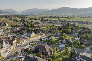 View of property location with a mountain backdrop and nearby suburban area