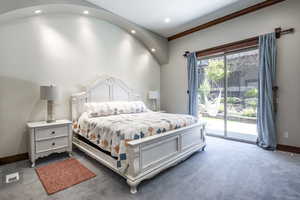 Carpeted bedroom with access to exterior, recessed lighting, and crown molding