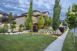 View of front of property featuring a front yard