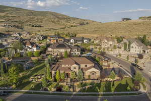 Aerial view of residential area featuring a mountainous background