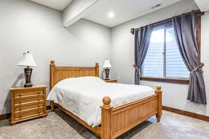 Bedroom with baseboards and carpet flooring