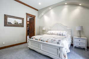 Bedroom featuring carpet, a walk in closet, and recessed lighting