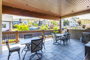 View of patio / terrace with outdoor dining area and a residential view