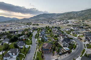 Aerial view of property's location with nearby suburban area and mountains