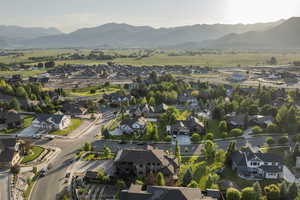 View of property location with a mountain backdrop and nearby suburban area