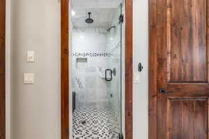 Full bath with a shower stall
