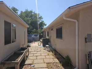 View of property exterior featuring a patio area and stucco siding