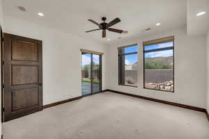 Unfurnished room featuring visible vents, baseboards, recessed lighting, and light carpet
