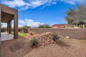 View of yard featuring a patio area and fence