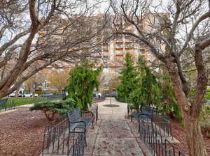 View of property's community with a patio area and fence