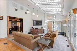 Living room featuring visible vents and french doors