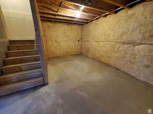 Unfinished basement with stairway