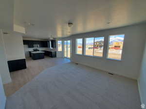 Large, open great room with large windows and lots of natural light.