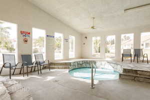 View of pool featuring ceiling fan and a pool