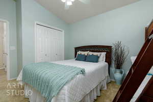 Bedroom featuring carpet floors, lofted ceiling, a closet, and a ceiling fan