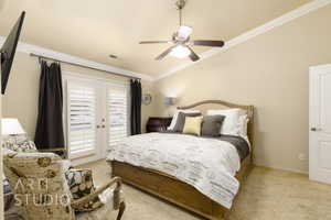 Bedroom with access to outside, light carpet, ornamental molding, ceiling fan, and french doors