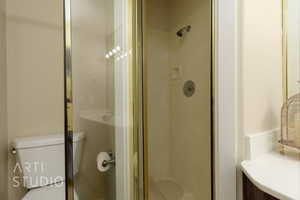 Full bathroom featuring a shower stall and vanity