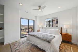 Bedroom featuring visible vents, baseboards, recessed lighting, access to exterior, and light wood-style flooring